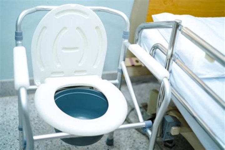 Do you put water in a bedside commode