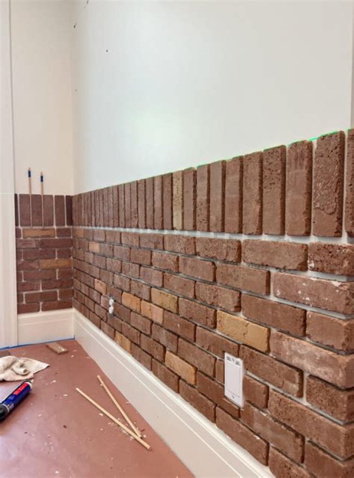 How do you cover an interior brick wall