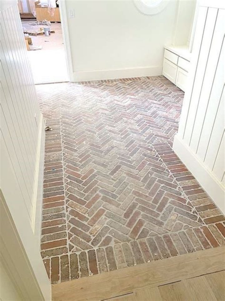 How do you lay a brick floor in a house