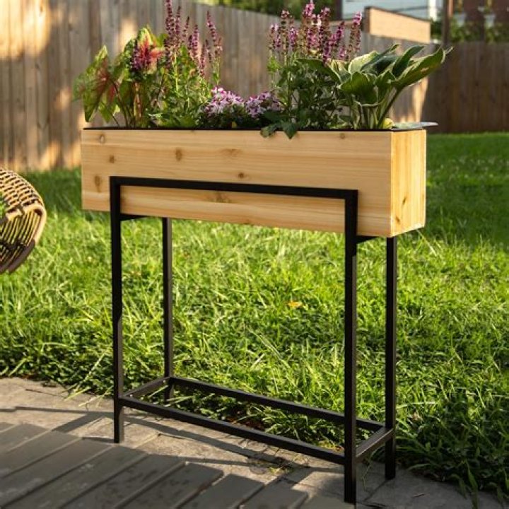 How do you line an elevated planter box