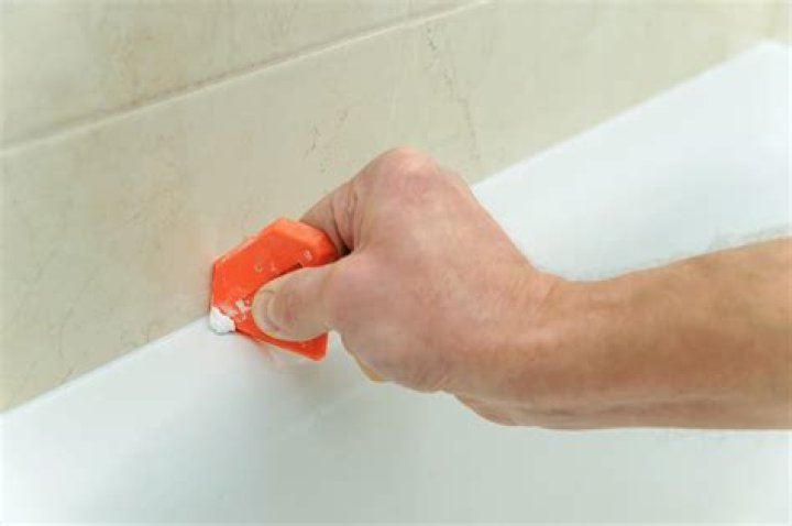 How do you remove acrylic caulk