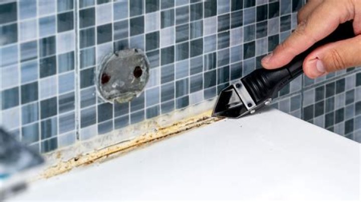 How do you remove sealant from vinyl flooring