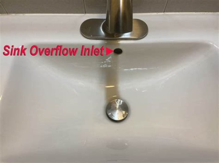 How do you unclog a sink overflow