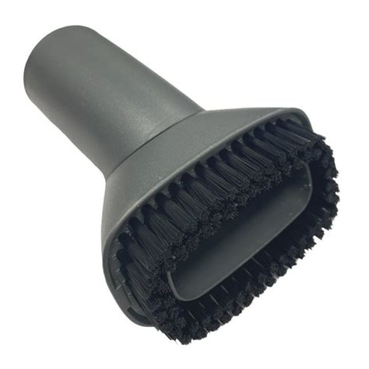 How do you use a vacuum dusting brush