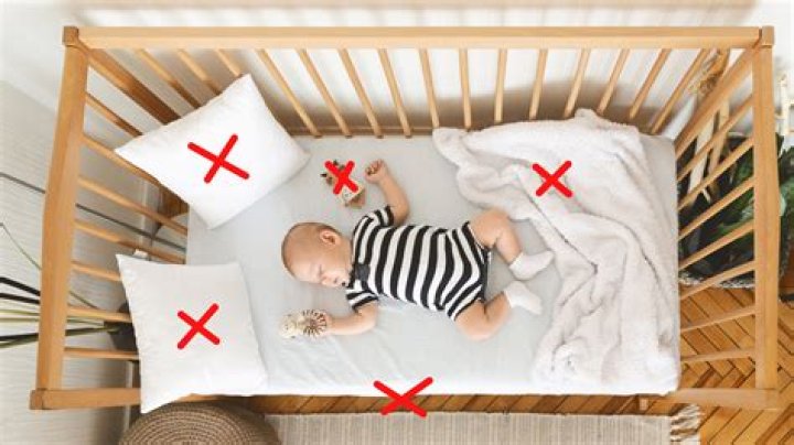 Is it safe to put two mattresses in a crib