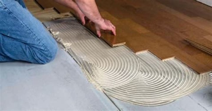 Should I glue solid wood flooring