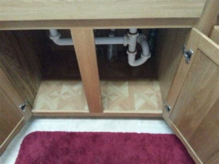 Should you tile under cabinets