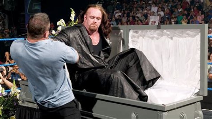 What do undertakers do to a dead body