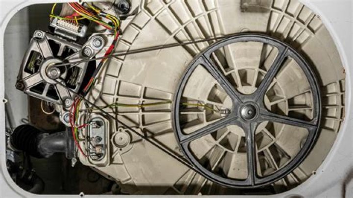 What does the motor do in a washing machine