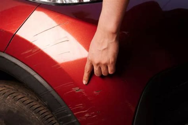 What removes deep scratches from cars