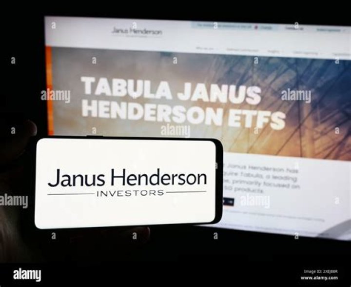 When did Janus merger with Henderson