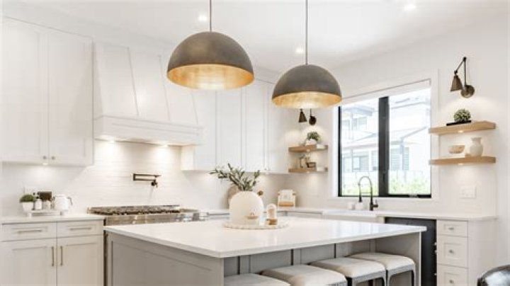 Where should pendant lights be placed over sink