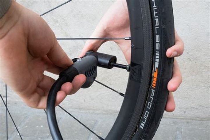Why does a bicycle tire expand when filled with gas