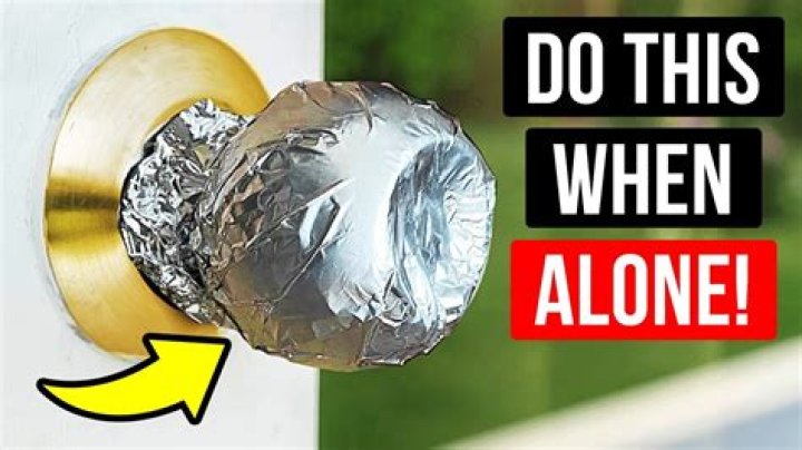 Why does a metal doorknob feel colder than the wooden door